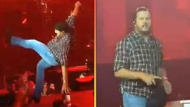 image for Luke Bryan Falls Hard on Stage After Slipping on a Fan's Phone